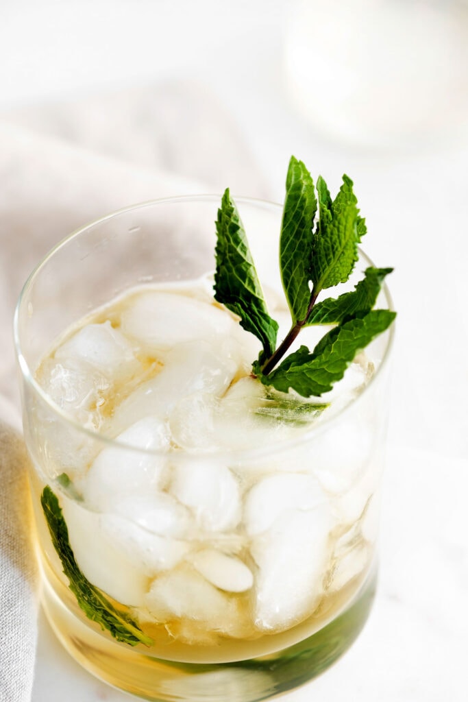 mint julep in a glass garnished with fresh mint