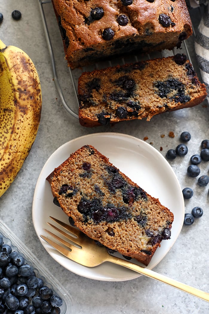 Slice of blueberry banana bread on a plate
