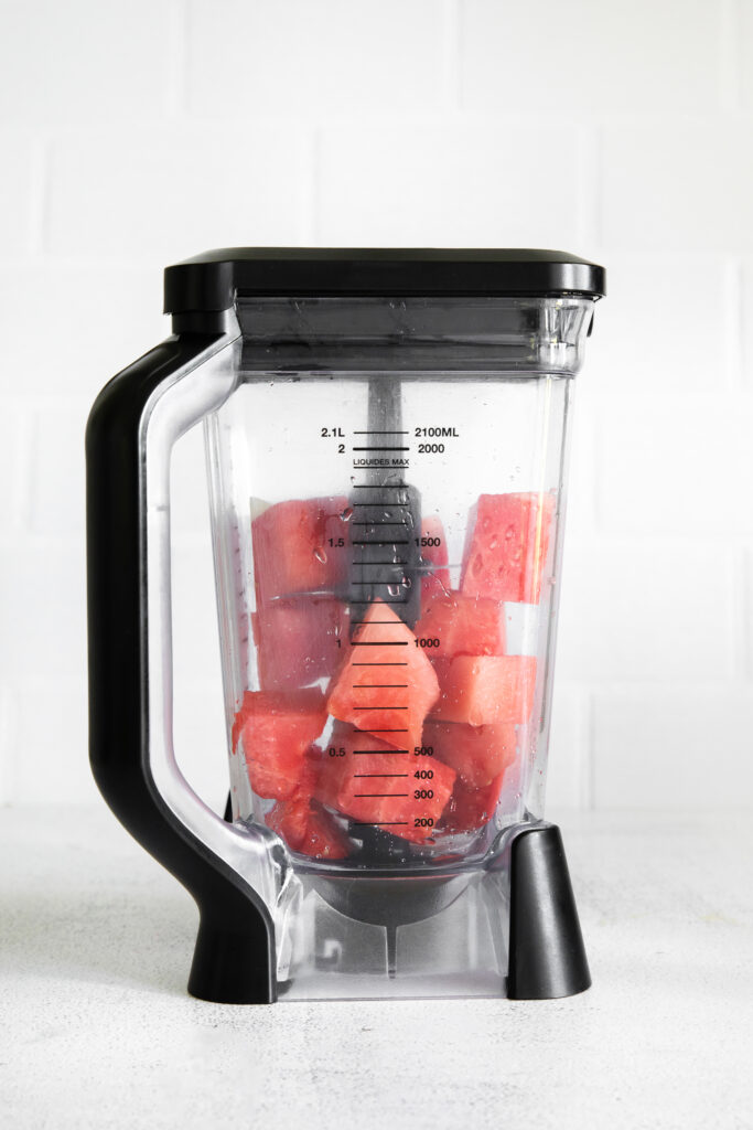 Watermelon cubes in a high speed blender.