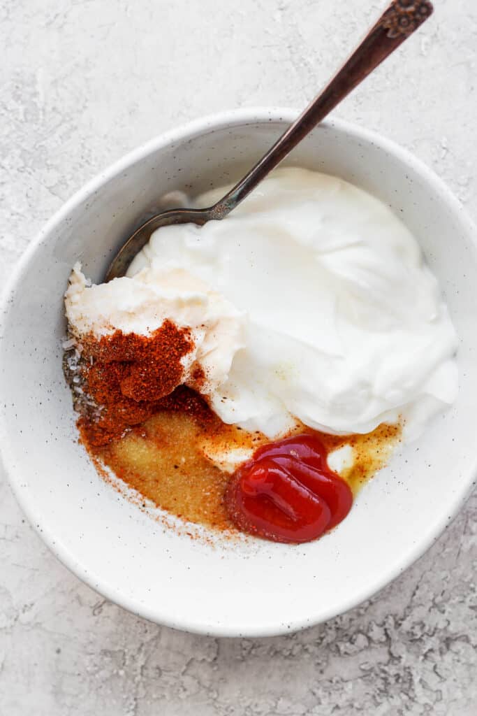 If you are looking for a staple chicken burger recipe, this is it! These ground chicken burgers are so flavorful and moist and topped with our secret burger sauce. secret burger sauce in bowl