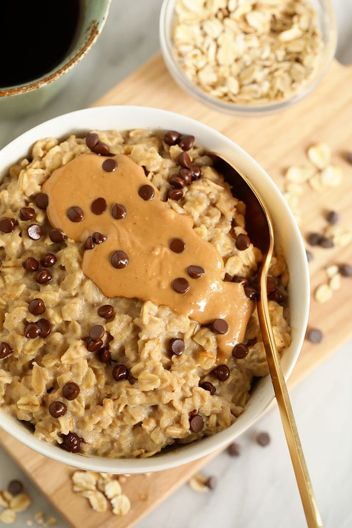 Make our 2-Minute Microwave Oatmeal! These oats taste exactly like cookie dough and they have 5g fiber and 7g protein per serving. oatmeal with cashew butter in bowl