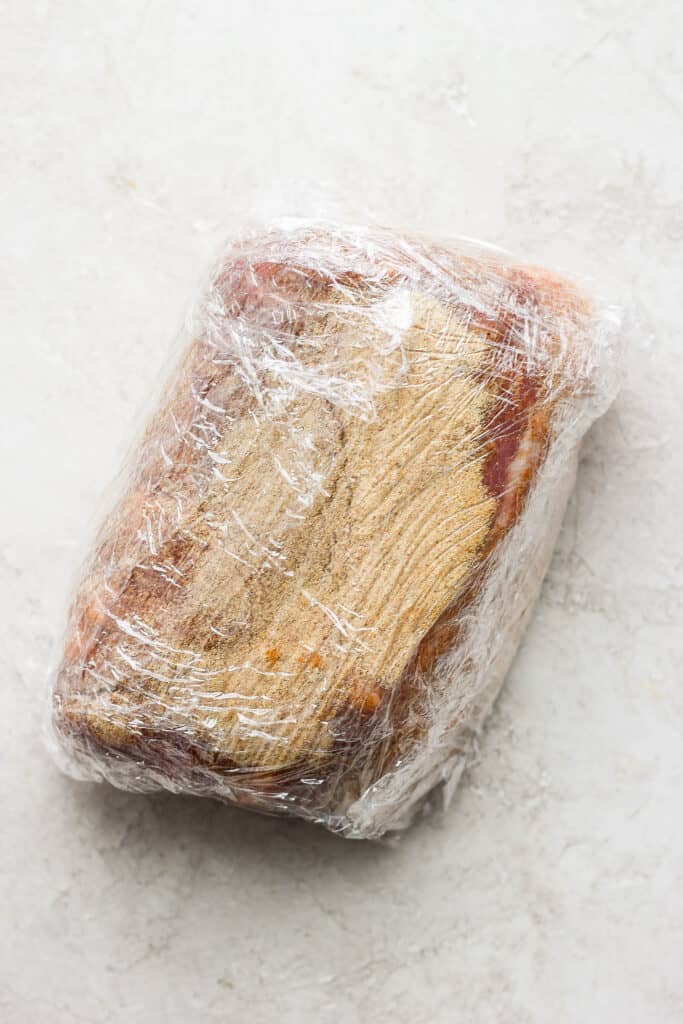 The best pork shoulder recipes are cooked low and slow. This slow roasted pork shoulder is slightly sweet and incredibly tender with crispy, crunchy edges. This is one of the best pork shoulder recipes of all time! pork wrapped in plastic wrap