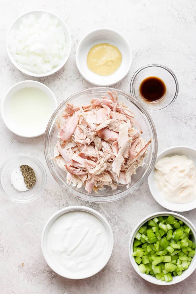 Got leftover smoked chicken? Make this super simple smoked chicken salad recipe for an easy way to re-purpose your leftovers! smoked chicken salad ingredients on countertop