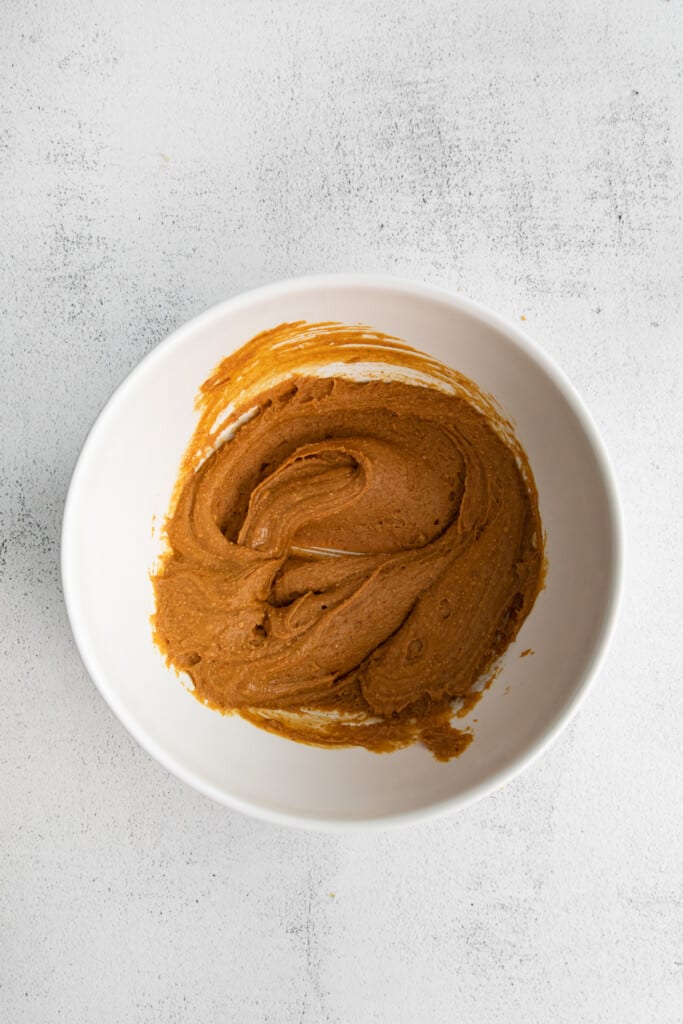 These healthy scotcheroos are made with all natural sugar, unsalted peanut butter, and coconut oil (no white sugar or corn syrup)! They are ready in no time and a great healthy spin on this classic dessert bar. healthy scotcheroo filling in a bowl