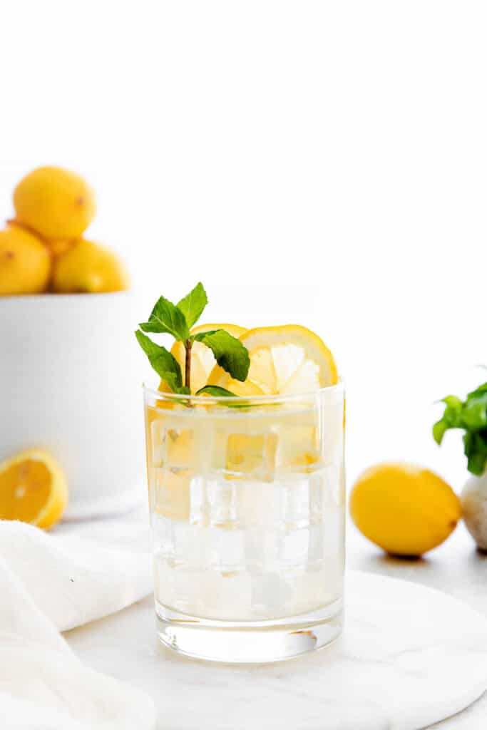 Vodka lemonade is the perfect easy cocktail to make any time of year. It's made with minimal ingredients and the perfect combo of sweet and sour. vodka lemonade in glass with ice