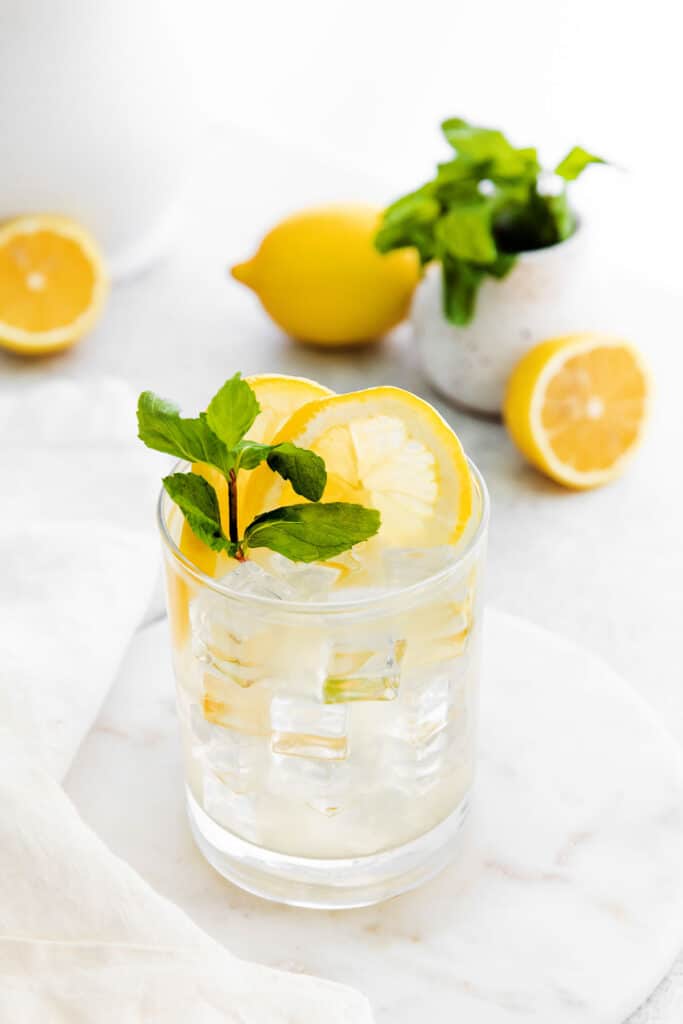 Vodka lemonade is the perfect easy cocktail to make any time of year. It's made with minimal ingredients and the perfect combo of sweet and sour. vodka lemonade in glass with fresh mint
