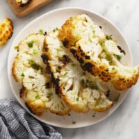 Grilled cauliflower steaks on plate