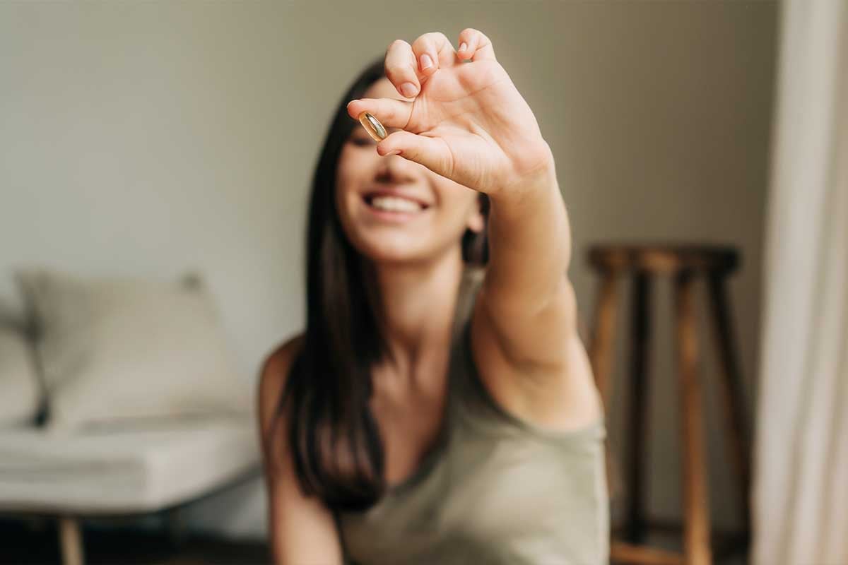 Woman holding supplements