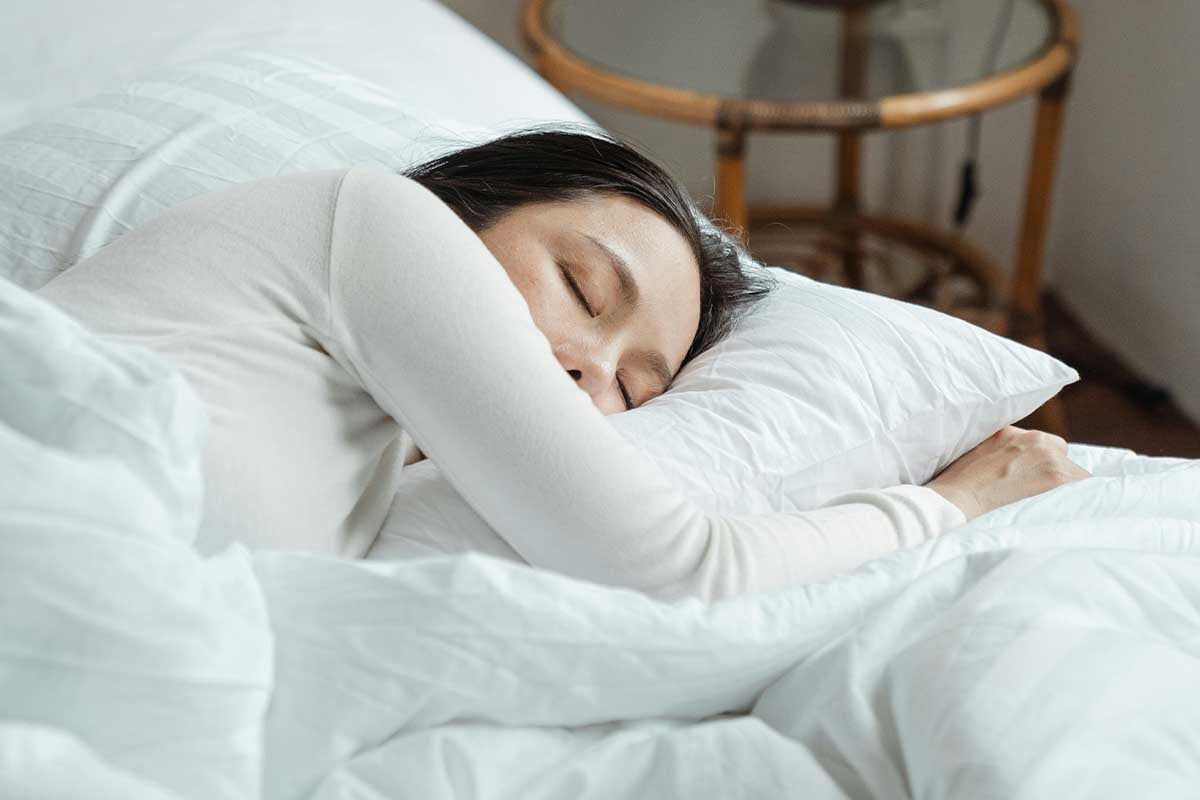Woman sleeping soundly in bed